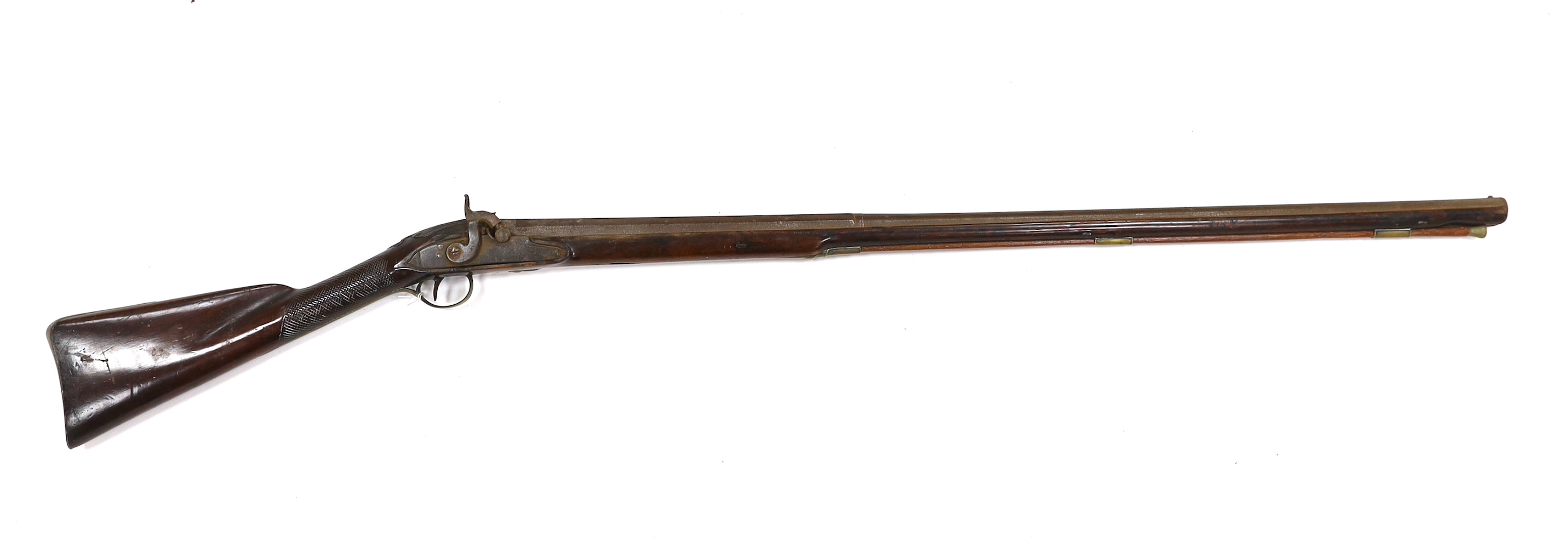 A 1786 percussion 12 bore fowling piece, converted from flintlock, with a fully stocked half octagonal barrel, London proofs, brass furniture and sideplate engraved IR 1786, chequered grip and wooden ramrod, barrel 96cm